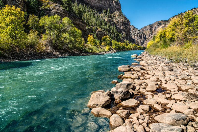 Glenwood Canyon is a rugged scenic 12.5 mi (20 km) canyon on the Colorado River in western Colorado in the United States. Its walls climb as high as 1,300 feet (400 m) above the Colorado River. It is the largest such canyon on the Upper Colorado.